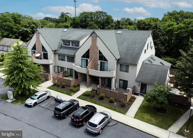 a aerial view of a house with swimming pool and garden