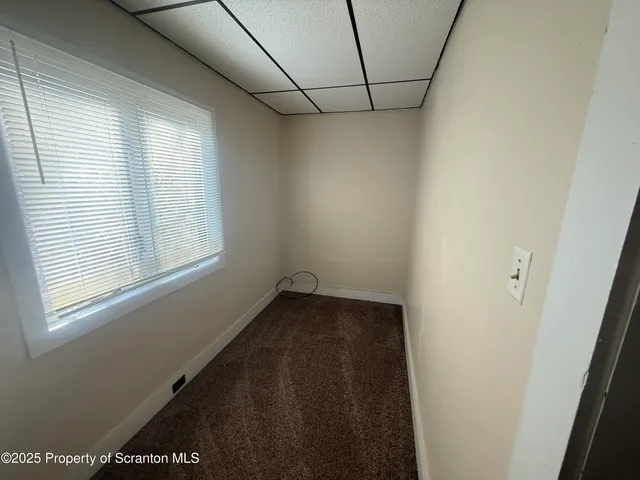 a view of a room with tiles and windows