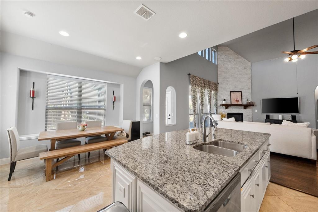 7235 Neblina Drive Grand Prairie, TX 75054 - Photo 13 of 32 a living room with fireplace furniture and a flat screen tv