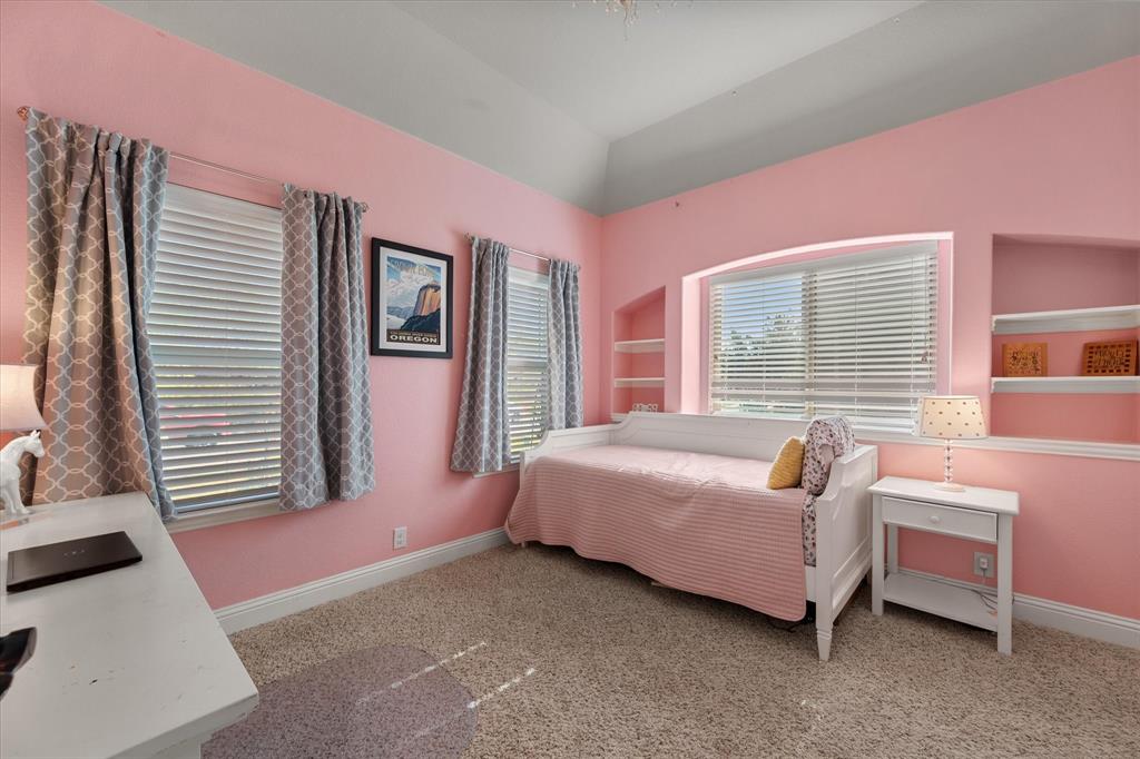 7235 Neblina Drive Grand Prairie, TX 75054 - Photo 19 of 32 a bedroom with a bed and a window