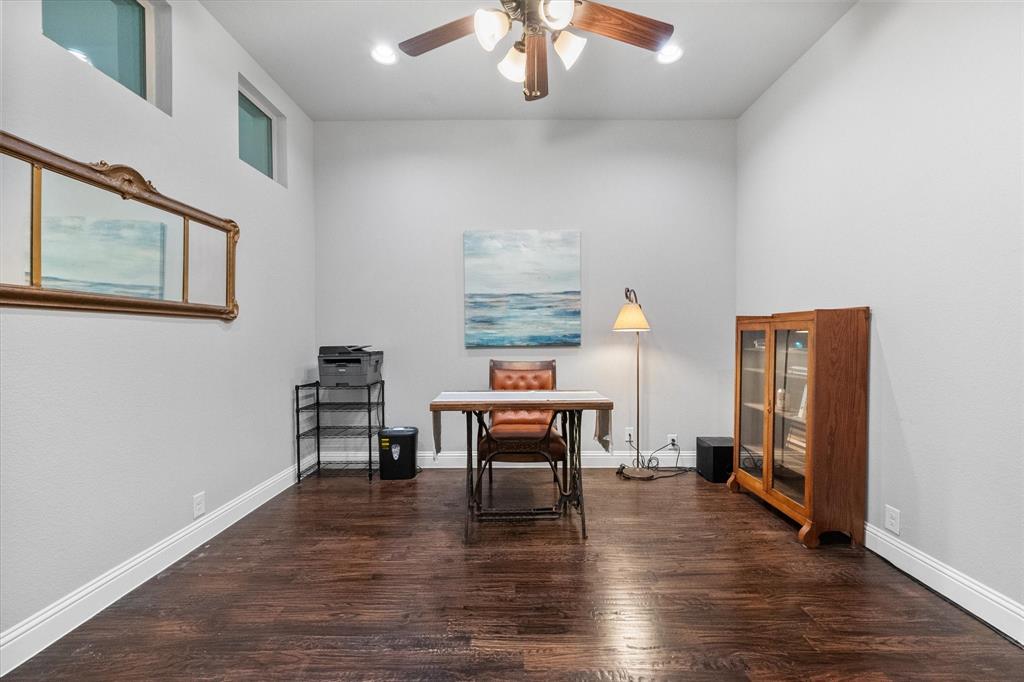 7235 Neblina Drive Grand Prairie, TX 75054 - Photo 23 of 32 a view of a livingroom with furniture and wooden floor