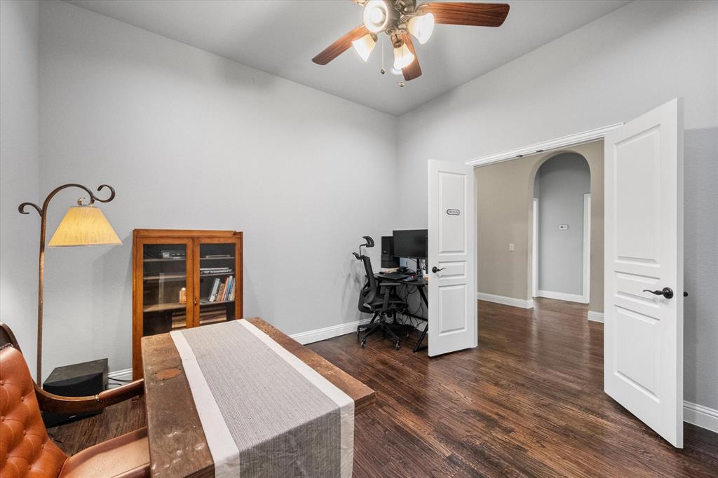 7235 Neblina Drive Grand Prairie, TX 75054 - Photo 24 of 32 a bedroom with a bed and a chandelier