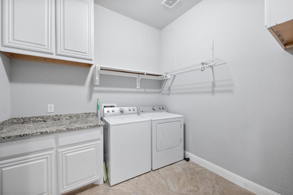 7235 Neblina Drive Grand Prairie, TX 75054 - Photo 26 of 32 a utility room with dryer and washer