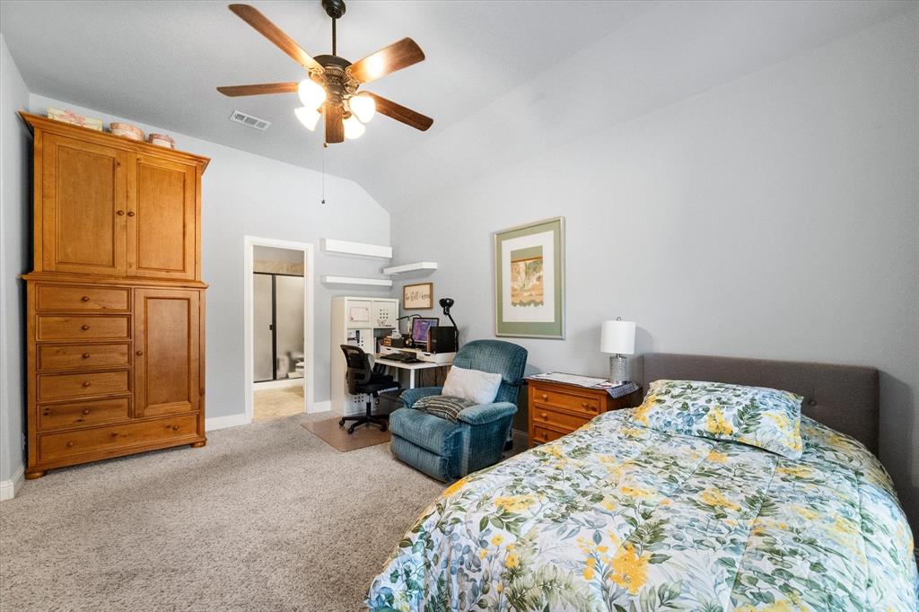 7235 Neblina Drive Grand Prairie, TX 75054 - Photo 27 of 32 a bedroom with bed and window