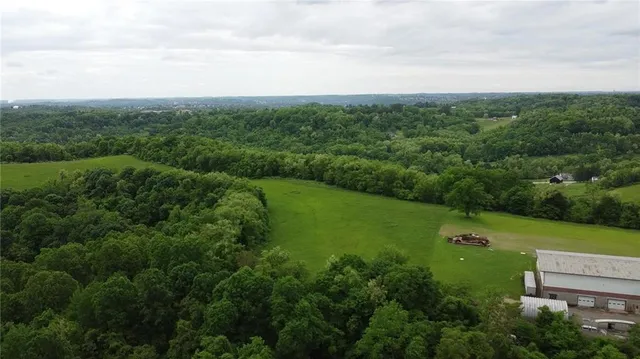 an aerial view of city with green space