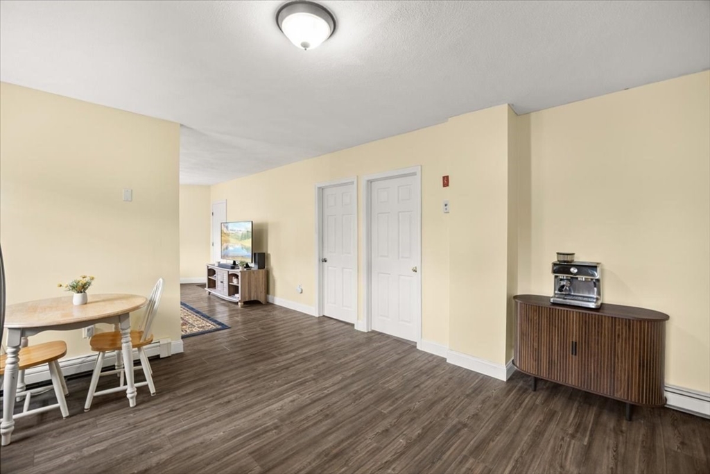 35 Hazel Street, Unit B Attleboro, MA 02703 - Photo 8 of 21 a living room with wooden floor and furniture