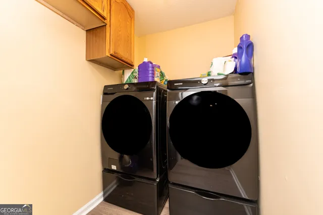 a utility room with dryer and washer