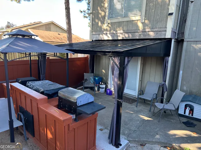 a backyard of a house with seating space