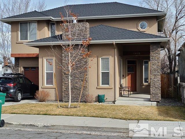 1410 Lander Street Reno, NV 89509 - Photo 1 of 1 a front view of a house with garden