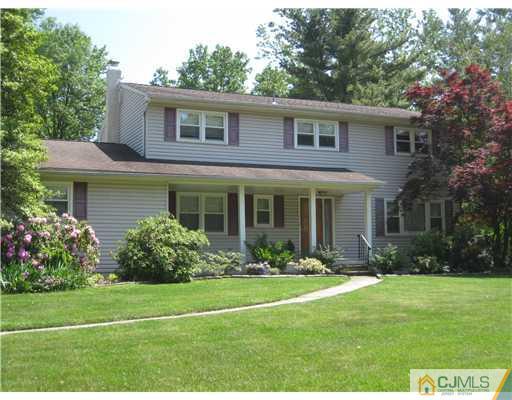 11 Devon Road Edison, NJ 08820 - Photo 1 of 23 a front view of a house with garden and porch
