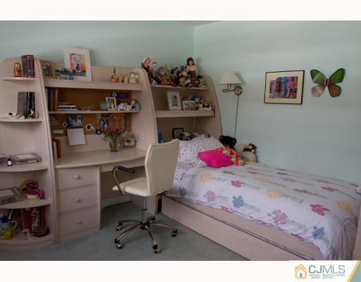 11 Devon Road Edison, NJ 08820 - Photo 12 of 23 a bedroom with a workspace