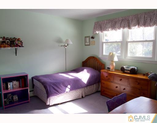 11 Devon Road Edison, NJ 08820 - Photo 14 of 23 a bedroom with a bed and a window