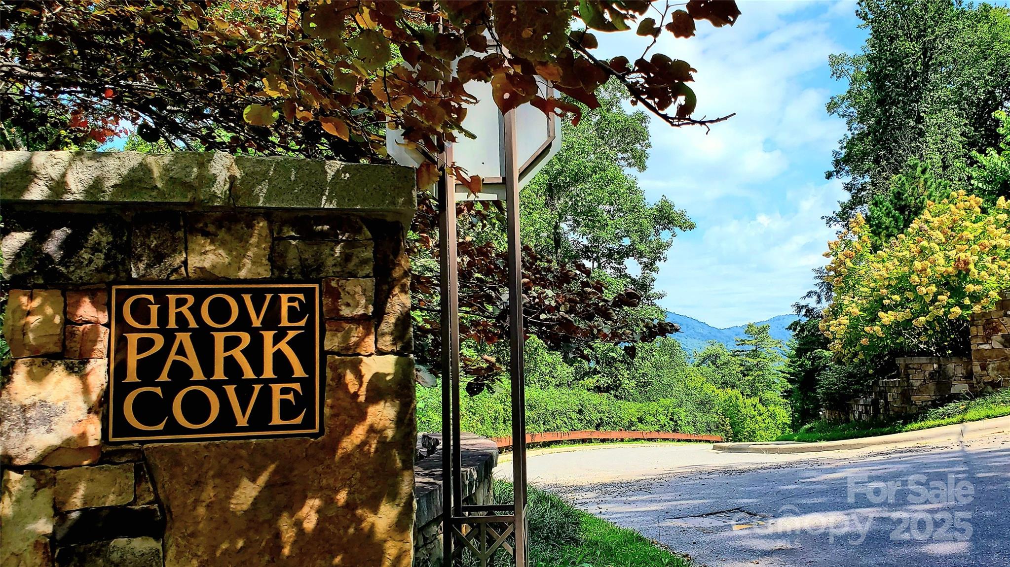 33 Grovepoint Way Asheville, NC 28804 - Photo 12 of 32 a street sign that is sitting on a brick wall
