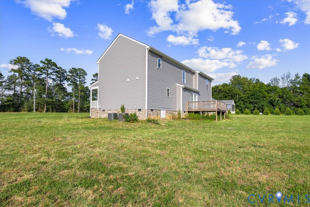 11325 Webb Road Disputanta, VA 23842 - Photo 31 of 32 a backyard of a house with lots of green space