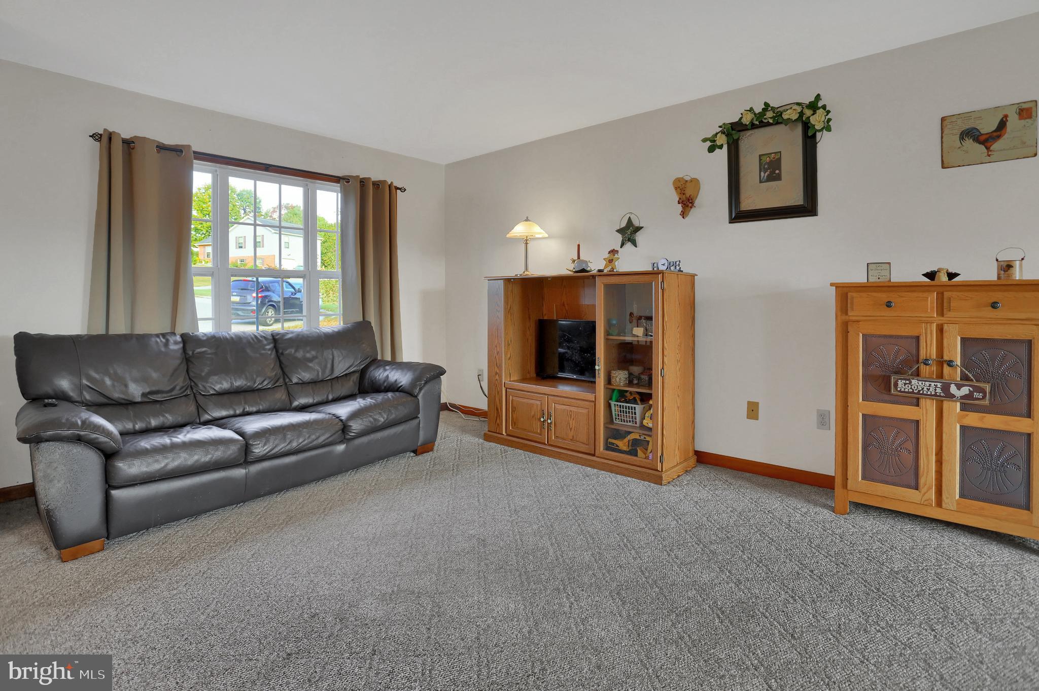 6124 Gregory Road Spring Grove, PA 17362 - Photo 5 of 43 a living room with furniture and a window