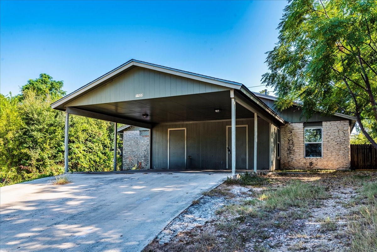 2302 Tern Circle, Unit B Austin, TX 78744 - Photo 1 of 1 a front view of house with yard