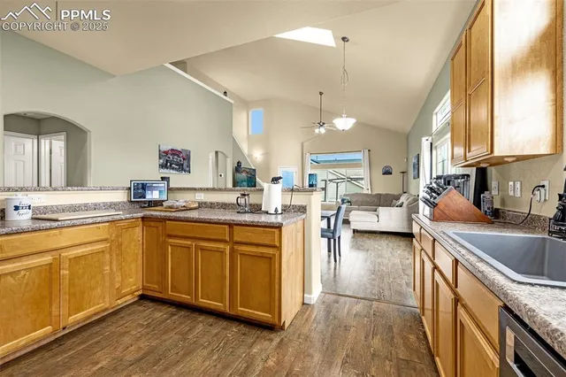 a kitchen with a sink stove and cabinets