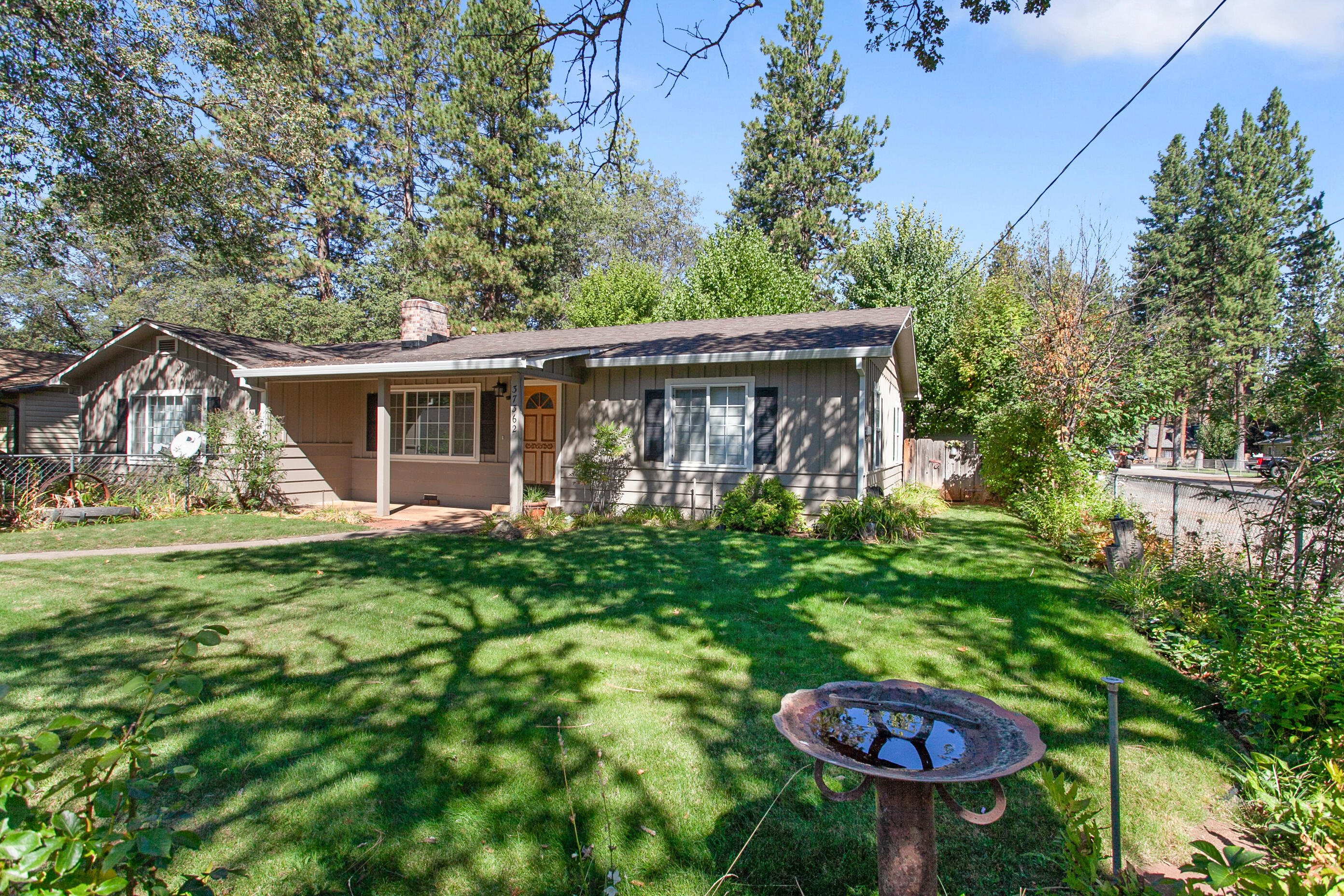 37362 Birch Avenue Burney, CA 96013 - Photo 3 of 27 a view of a house with backyard