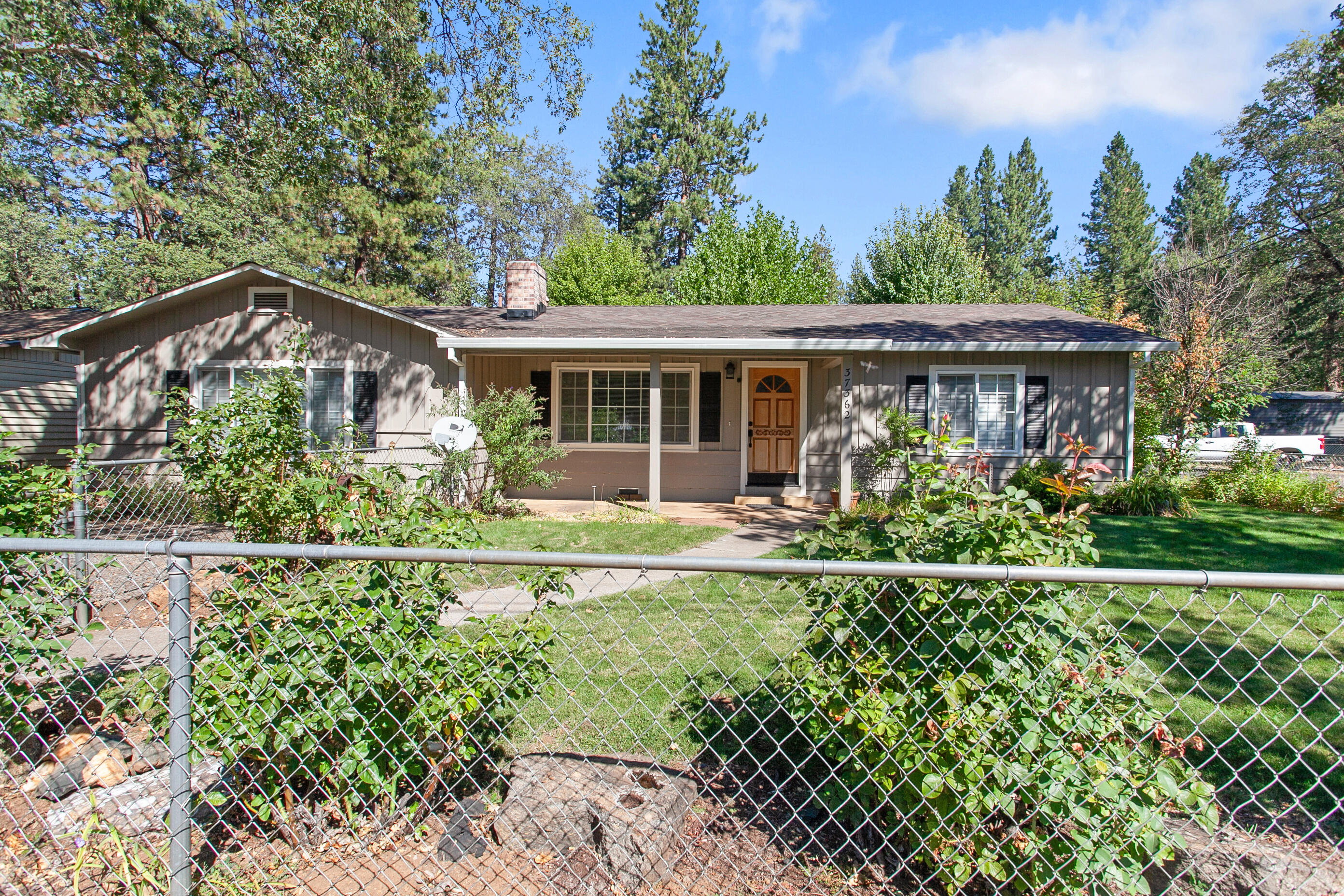 37362 Birch Avenue Burney, CA 96013 - Photo 4 of 27 front view of a house with a yard
