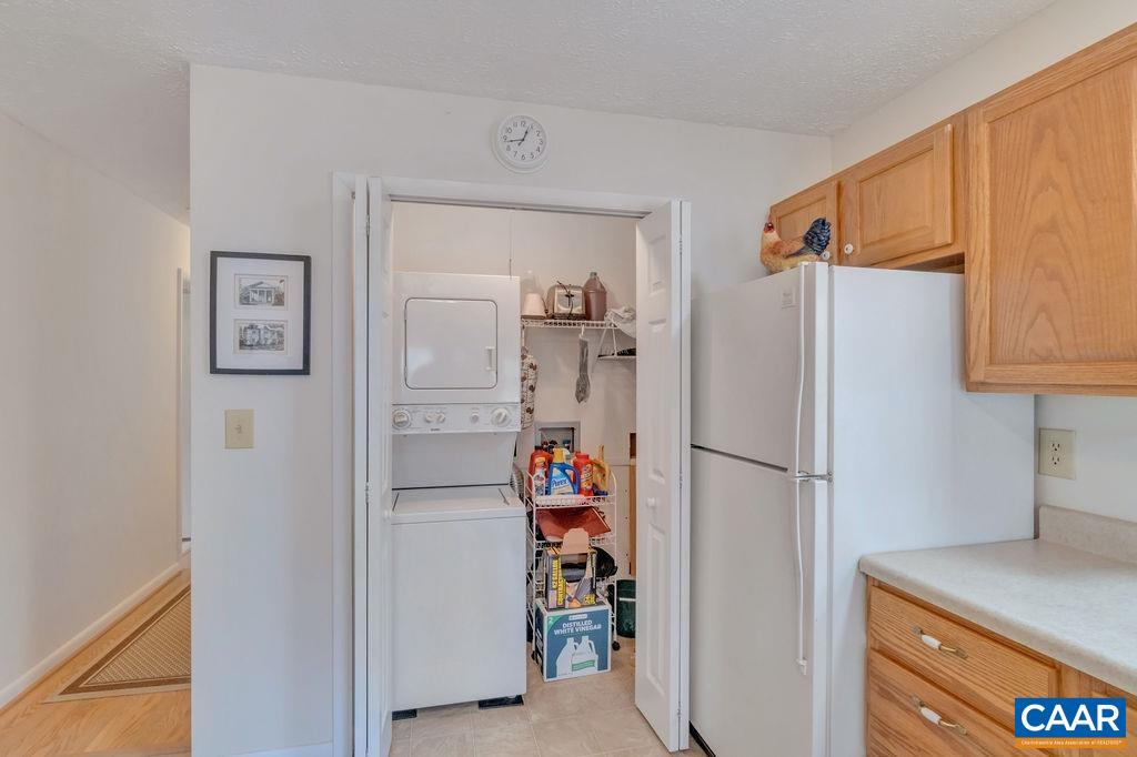 232 Rising Sun Road Palmyra, VA 22963 - Photo 14 of 31 a white refrigerator freezer and a stove sitting inside of a kitchen