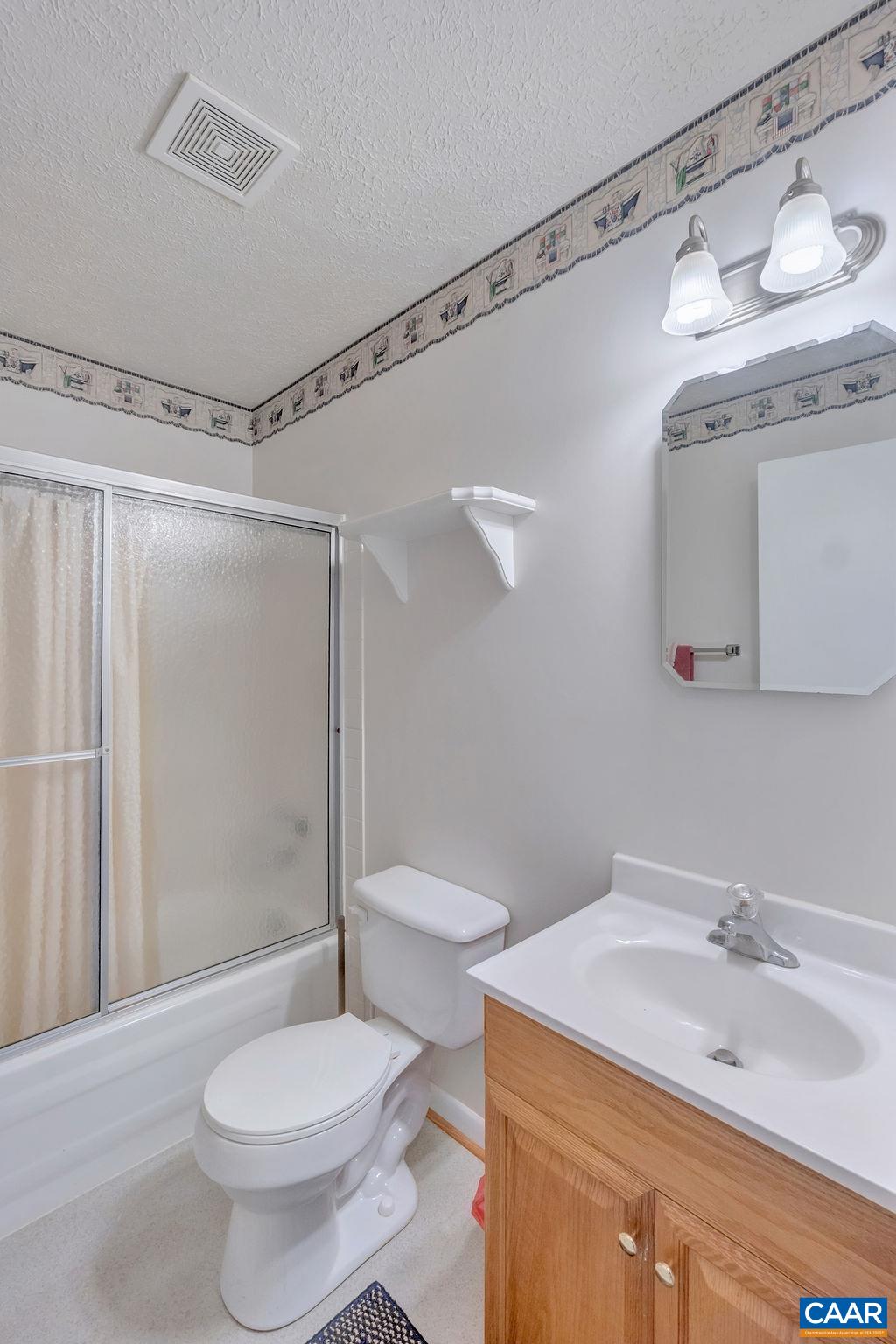 232 Rising Sun Road Palmyra, VA 22963 - Photo 17 of 31 a bathroom with a sink toilet and shower