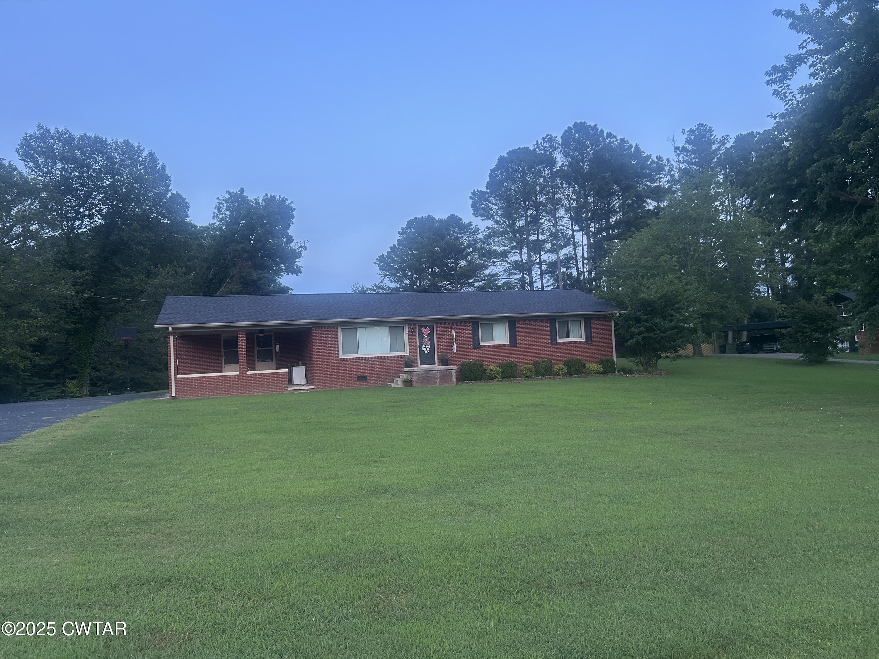 725 East Poplar Drive Decaturville, TN 38329 - Photo 1 of 43 a view of a house with a yard