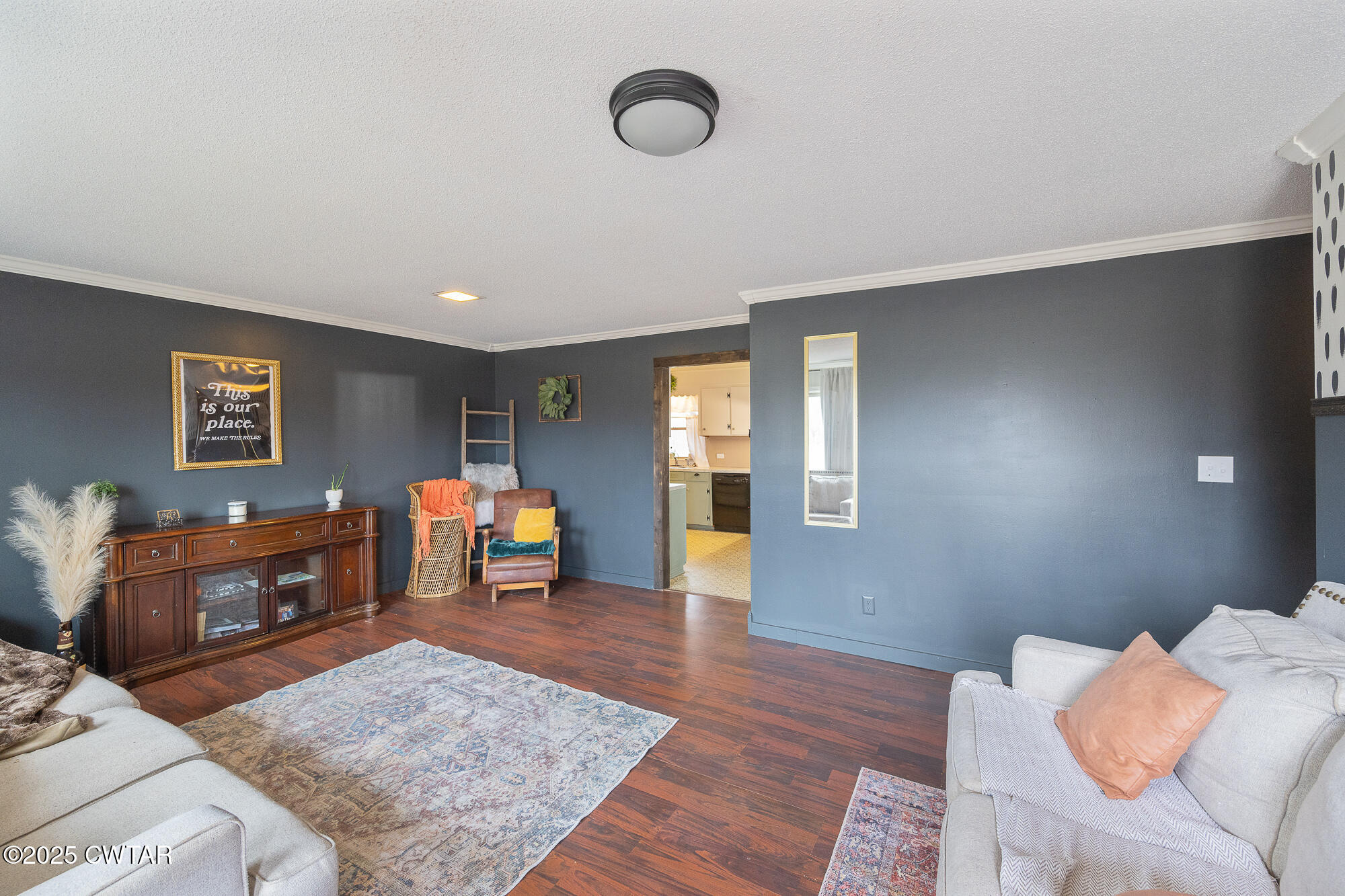725 East Poplar Drive Decaturville, TN 38329 - Photo 17 of 43 a living room with furniture and a wooden floor