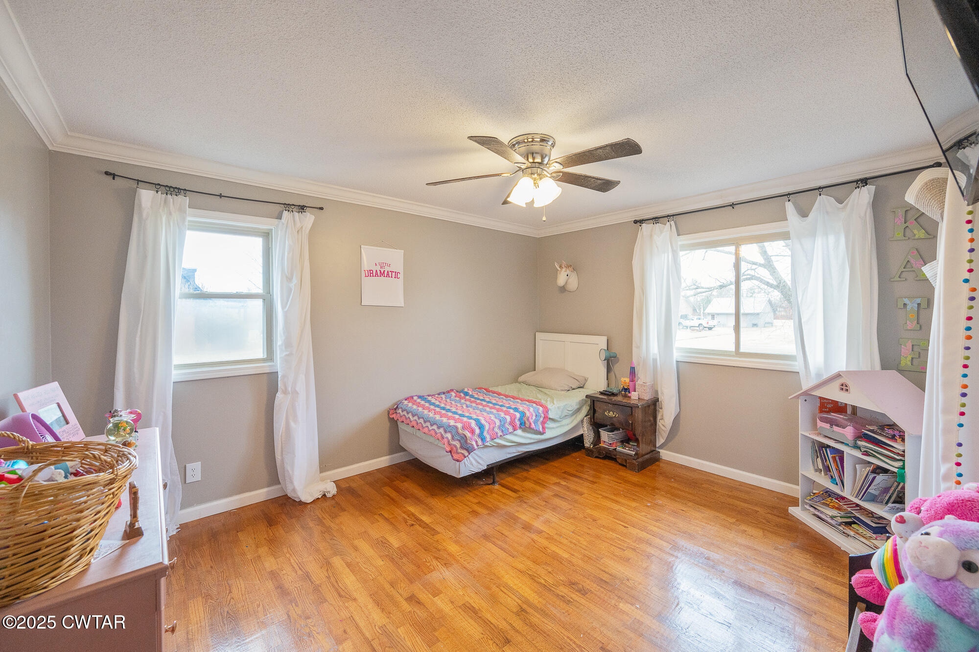 725 East Poplar Drive Decaturville, TN 38329 - Photo 21 of 43 a bedroom with a bed and wooden floor