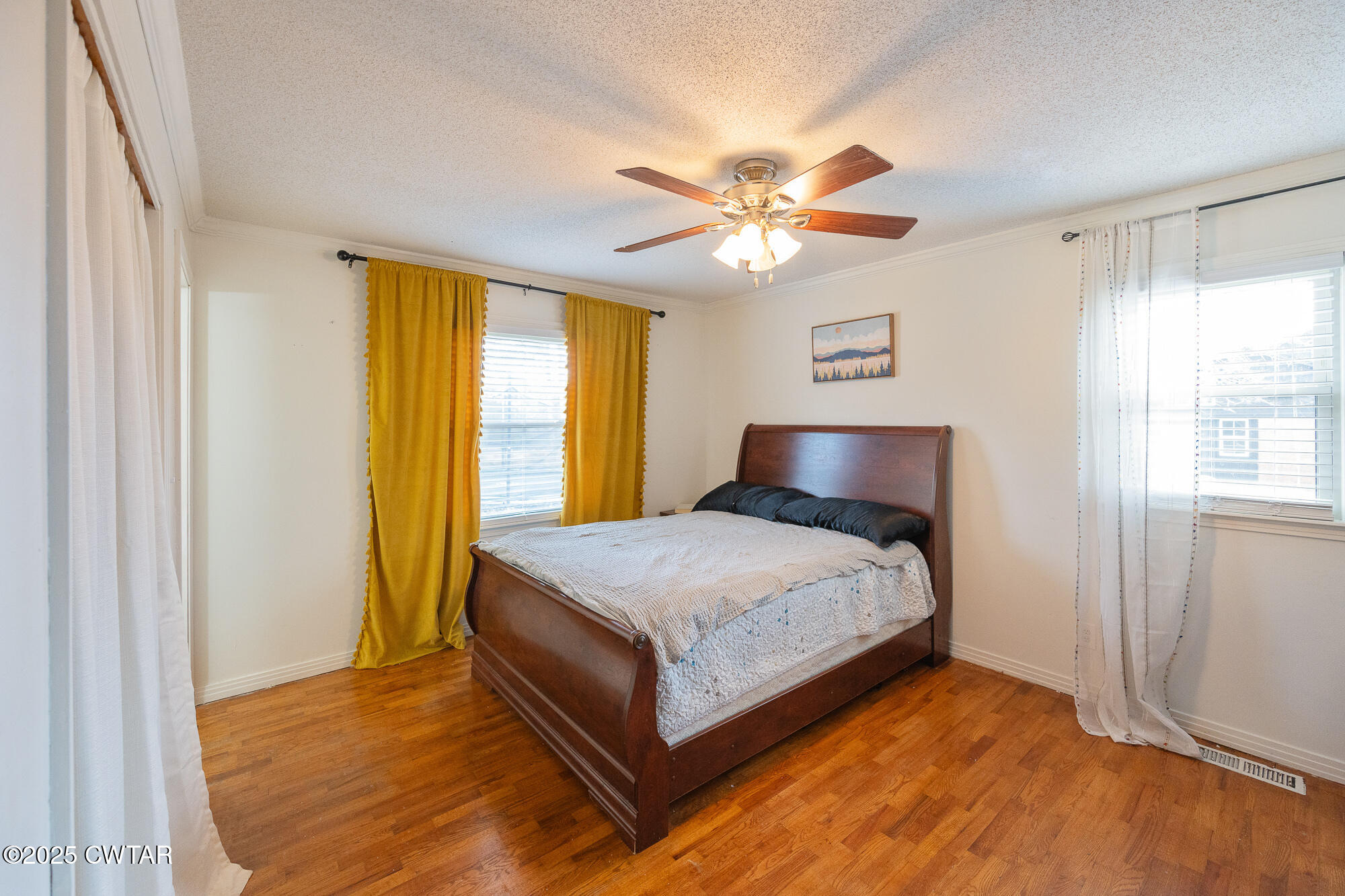 725 East Poplar Drive Decaturville, TN 38329 - Photo 22 of 43 a bedroom with a bed and a window