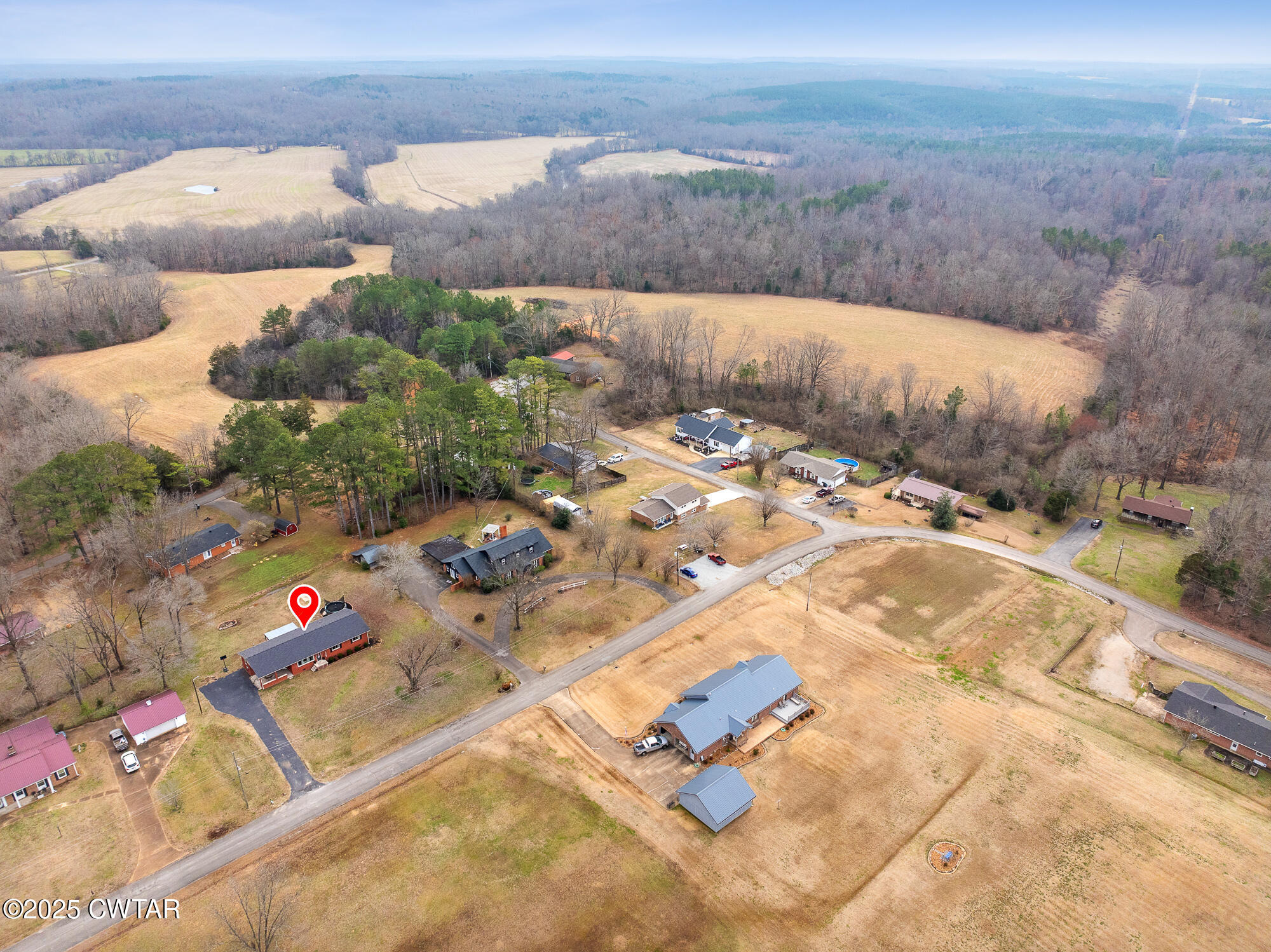725 East Poplar Drive Decaturville, TN 38329 - Photo 30 of 43 an aerial view of residential houses with outdoor space