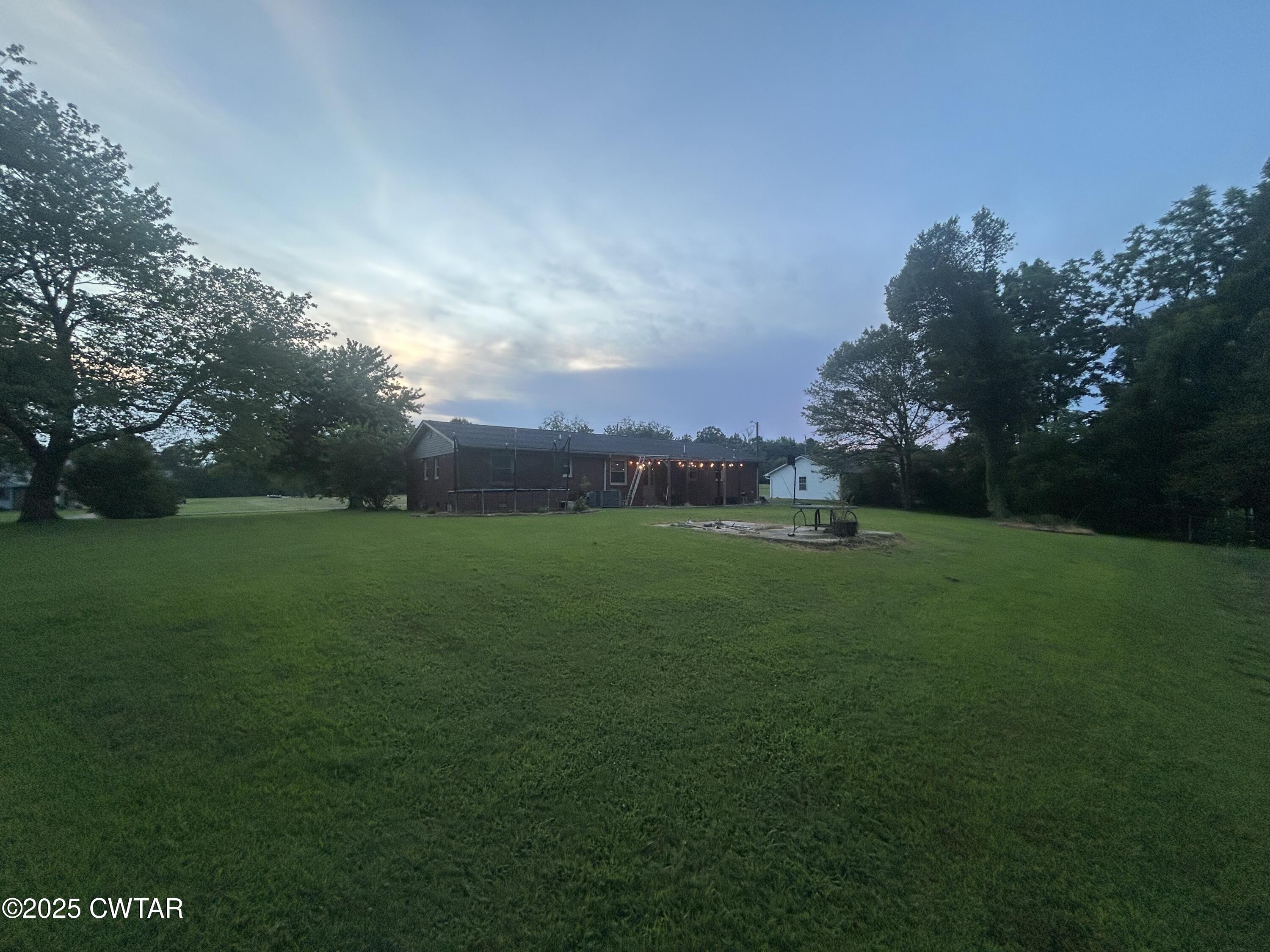 725 East Poplar Drive Decaturville, TN 38329 - Photo 3 of 43 a view of a field and trees