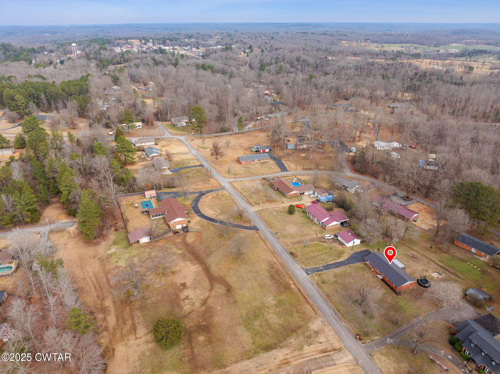 725 East Poplar Drive Decaturville, TN 38329 - Photo 31 of 43 an aerial view of residential houses with outdoor space