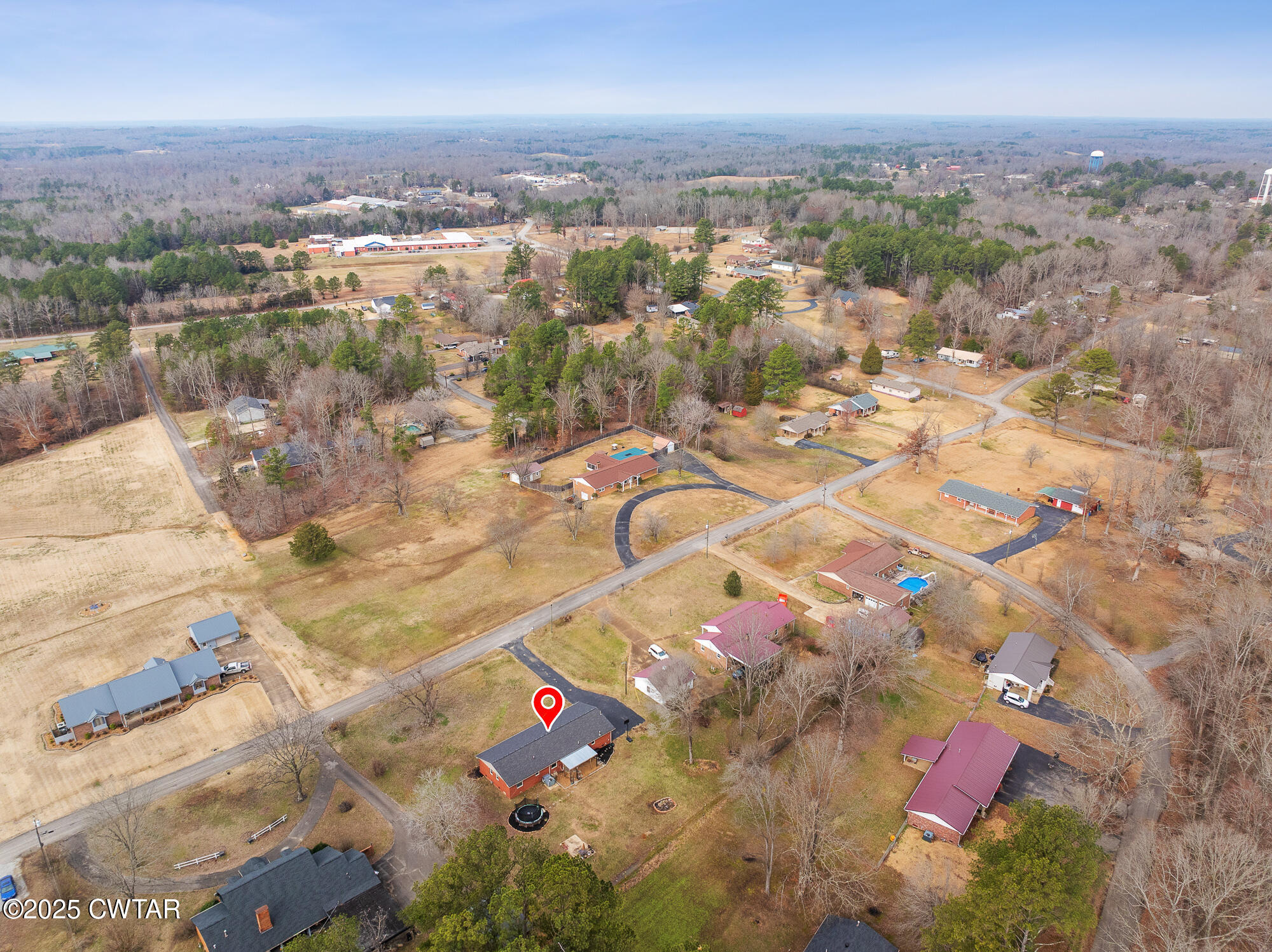 725 East Poplar Drive Decaturville, TN 38329 - Photo 32 of 43 an aerial view of residential houses with outdoor space