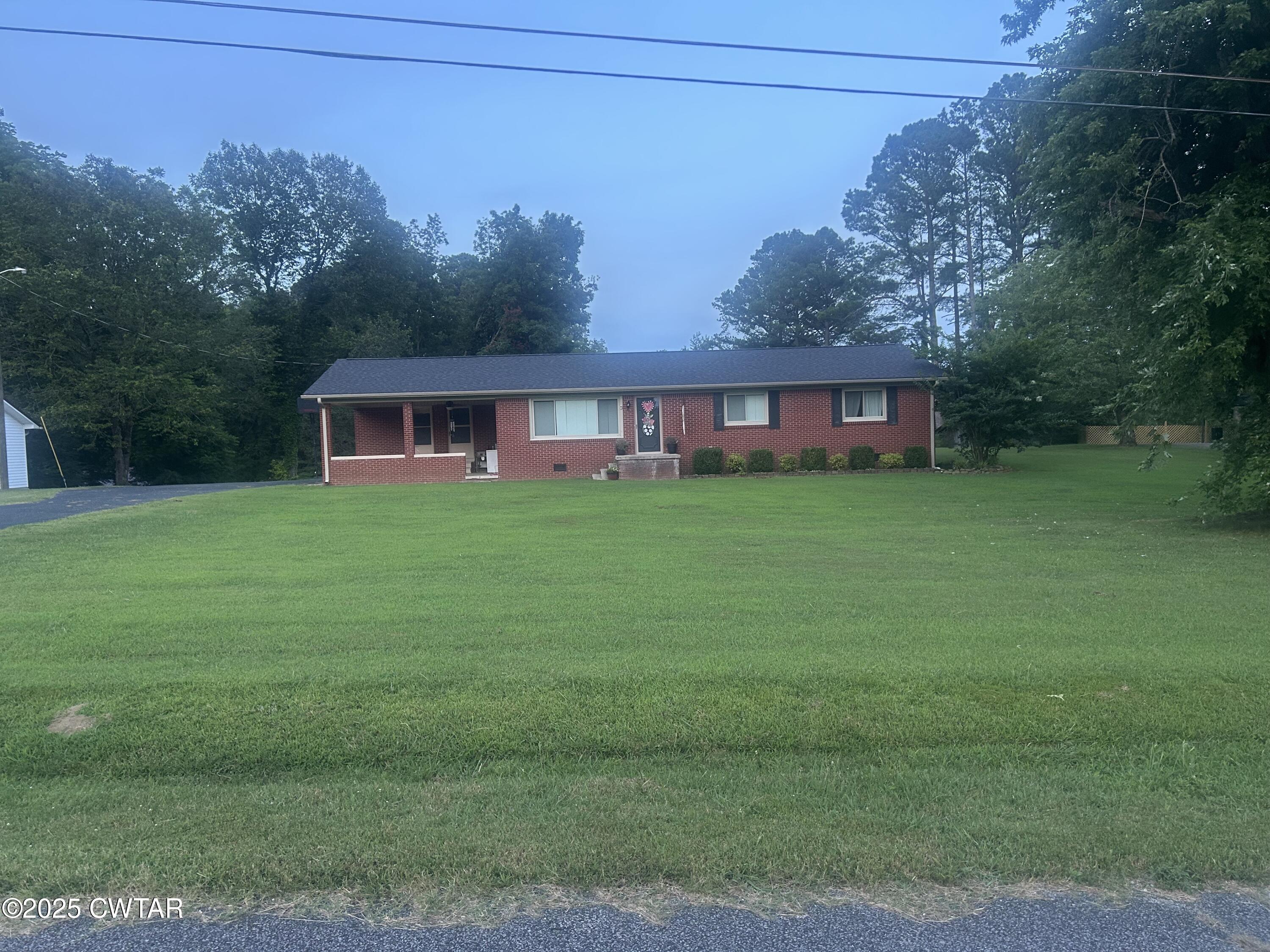 725 East Poplar Drive Decaturville, TN 38329 - Photo 38 of 43 a view of a house with a big yard