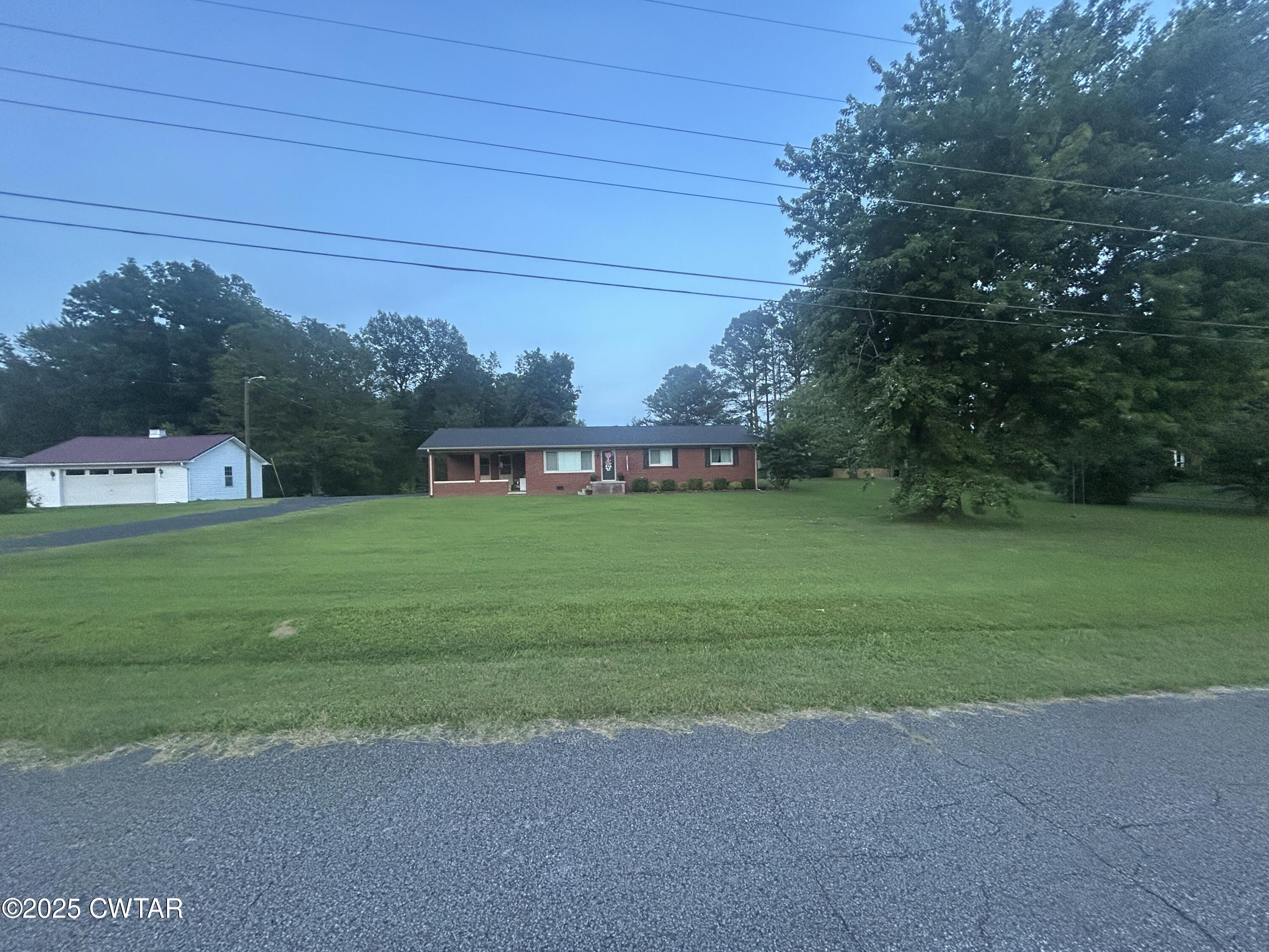725 East Poplar Drive Decaturville, TN 38329 - Photo 39 of 43 a view of a play house with a yard