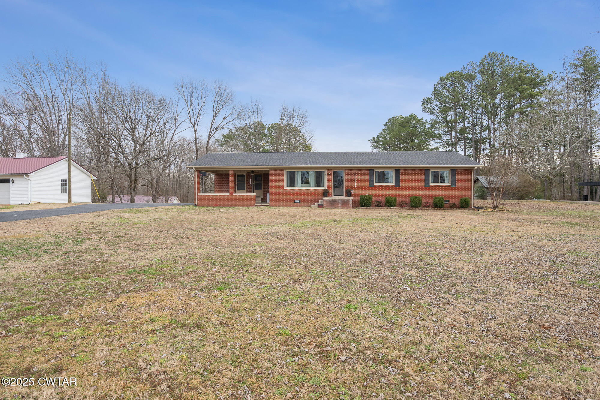 725 East Poplar Drive Decaturville, TN 38329 - Photo 6 of 43 a view of a house with a yard and sitting area