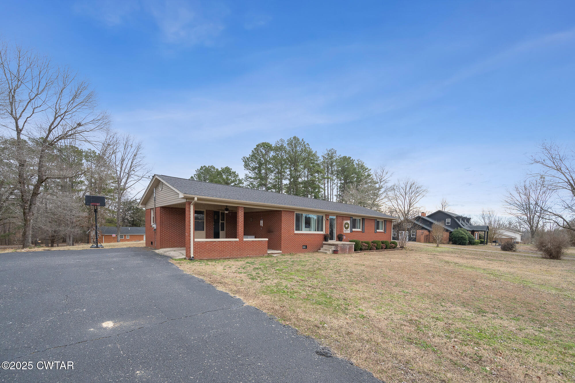 725 East Poplar Drive Decaturville, TN 38329 - Photo 7 of 43 front view of a house with a yard