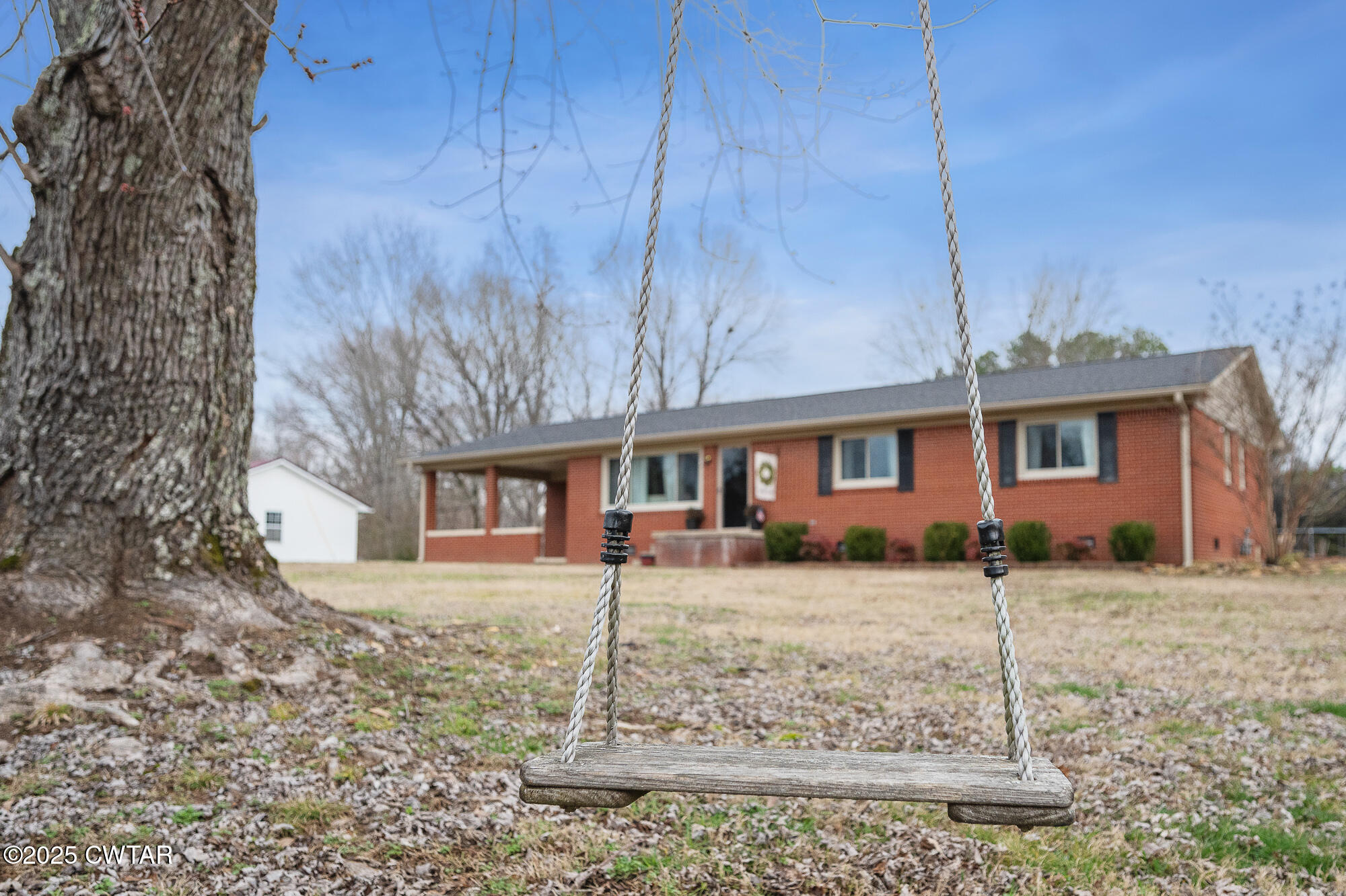 725 East Poplar Drive Decaturville, TN 38329 - Photo 8 of 43 a front view of a house with a yard