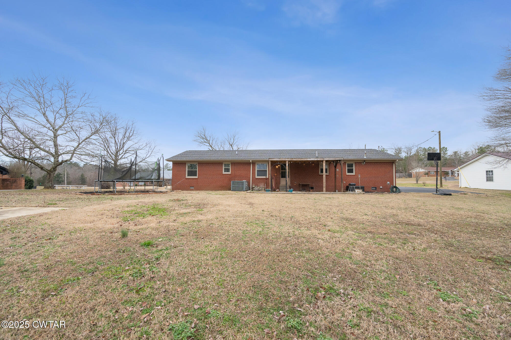 725 East Poplar Drive Decaturville, TN 38329 - Photo 9 of 43 a front view of a house with a yard