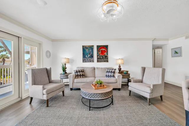 a view of a house with a big yard and large trees