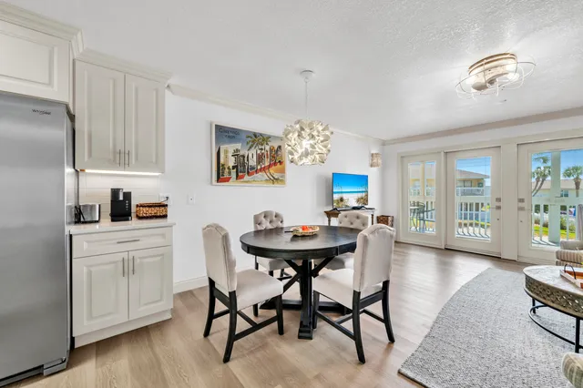 a view of an chairs and table in the balcony