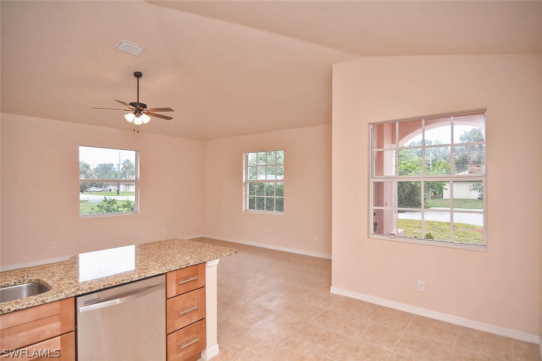 18632 Holly Road Fort Myers, FL 33967 - Photo 11 of 16 a kitchen with a refrigerator and window