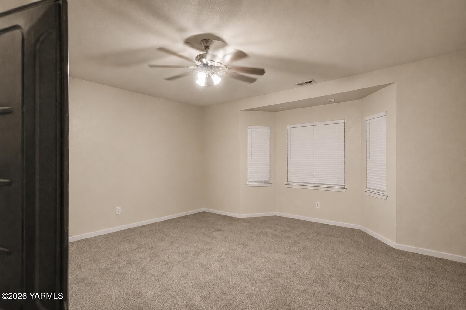 1811 Beam Road Granger, WA 98932 - Photo 11 of 26 a view of an empty room with a window