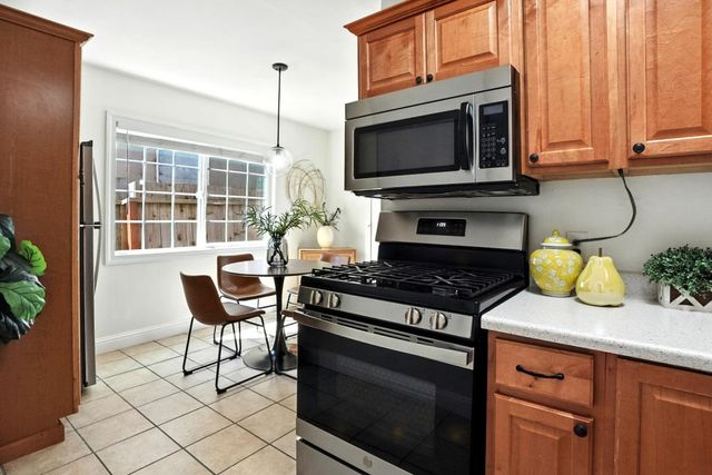 a kitchen with a stove and a microwave