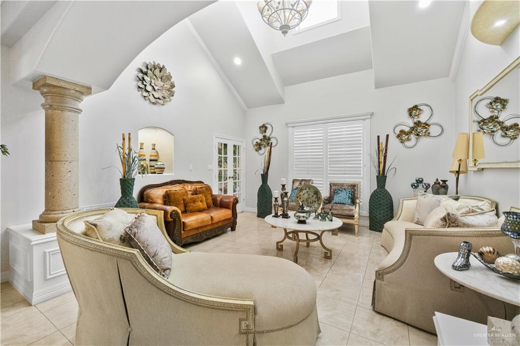 800 East Mile 3 Road Mission, TX 78573 - Photo 13 of 45 Sitting room with high vaulted ceiling, light tile patterned flooring, arched walkways, and recessed lighting