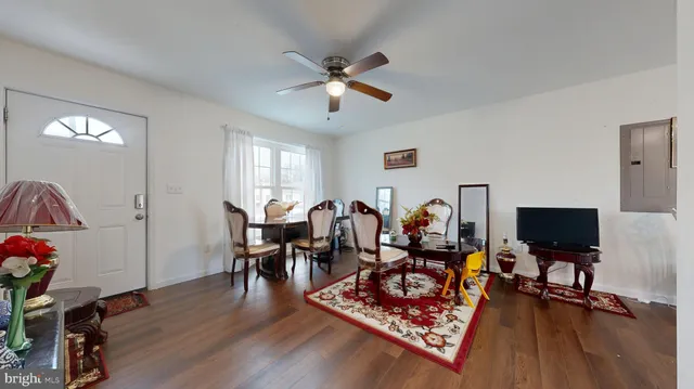 a bathroom with a sink vanity mirror and toilet