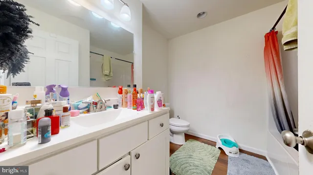 a bedroom with a bed and a flat tv screen