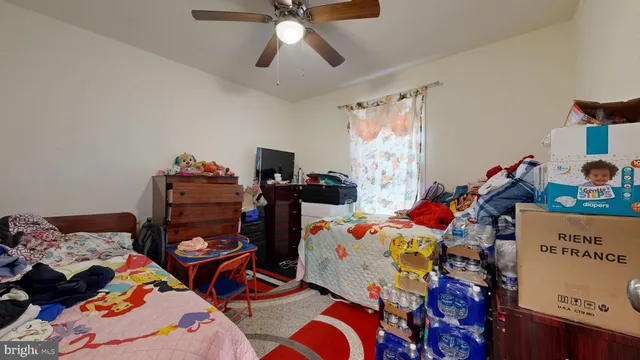 a bed room with a bed and a chair