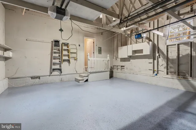 a front view of house with yard garage and green space