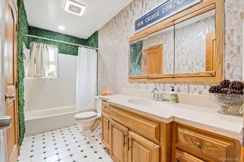 a view of a livingroom with furniture and a window